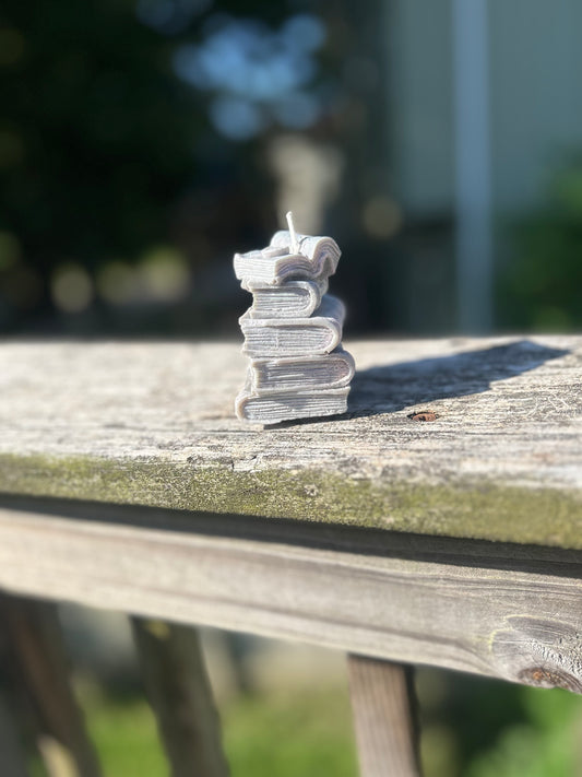 Stacked Books 🔍 📚🕯️