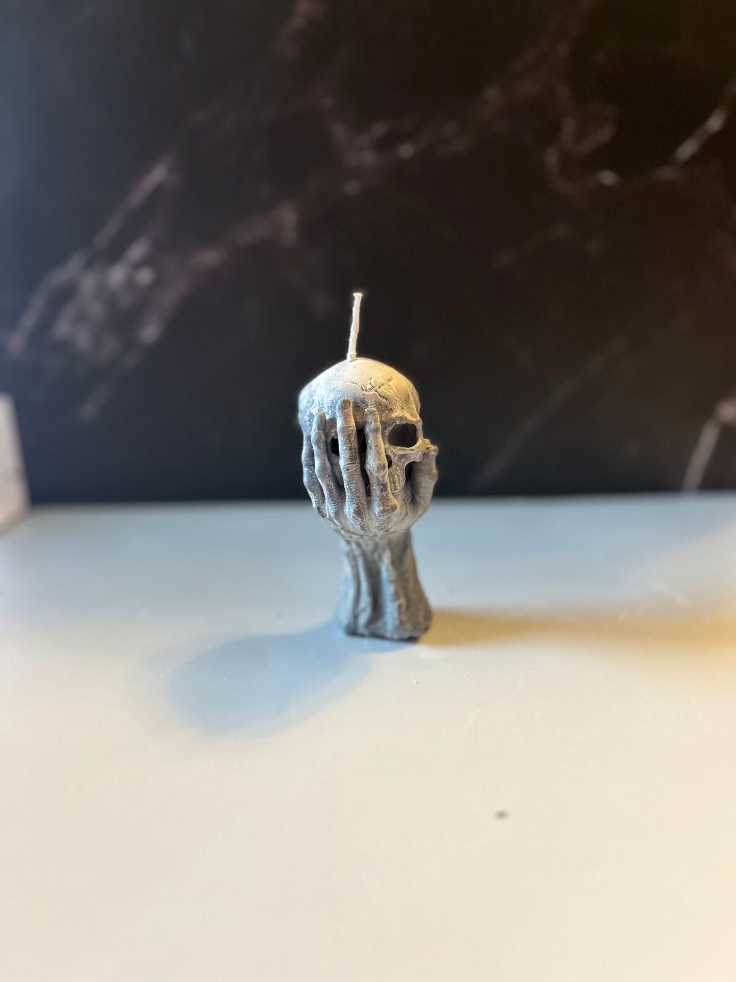 Skull in Hand Candle 💀🕯️