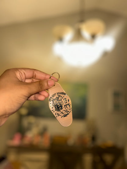 “It’s not hoarding, if it’s books” motel keychain