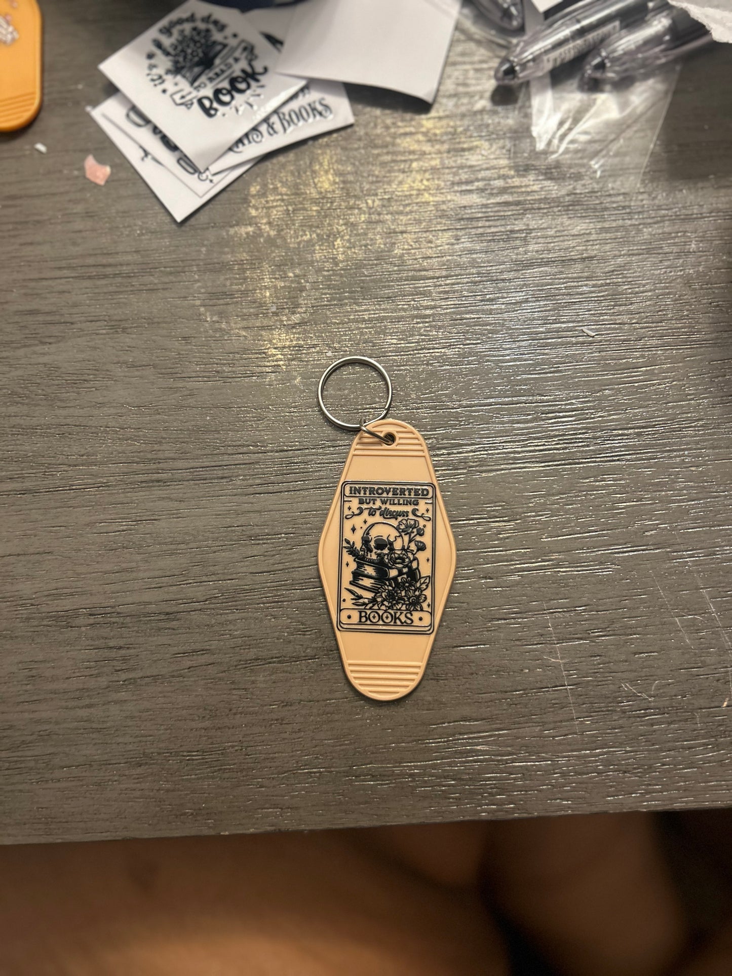 “Introverted, but willing to discuss books” motel keychain 🗝️📚